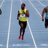 Tyson Gay of the U.S. (C) leads compatriot Ryan Bailey (R) and Nickel Ashmeade of Jamaica across the finish line winning the men's 100 meter