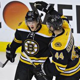 Boston Bruins Torey Krug (L) is congratulated by teammate Dennis Seidenberg after scoring against the New York Rangers during Game 5 of thei