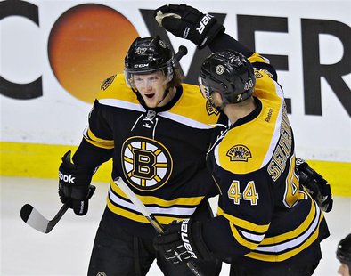 Boston Bruins Torey Krug (L) is congratulated by teammate Dennis Seidenberg after scoring against the New York Rangers during Game 5 of thei Boston Bruins Torey Krug (L) is congratulated by teammate Dennis Seidenberg after scoring against the New York Rangers during Game 5 of thei