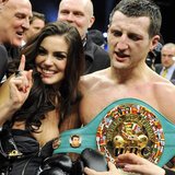 Britain's Carl "The Cobra" Froch holding the WBC super middleweights belt celebrates with wife Rachael Coardingly after defeating Germany's 