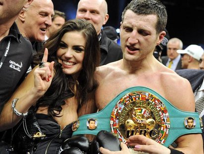 Britain's Carl "The Cobra" Froch holding the WBC super middleweights belt celebrates with wife Rachael Coardingly after defeating Germany's Britain's Carl "The Cobra" Froch holding the WBC super middleweights belt celebrates with wife Rachael Coardingly after defeating Germany's