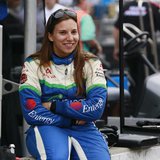 KV Racing Technology driver Simona de Silvestro of Switzerland sits on the pit lane wall smiling during a practice session prior to qualific