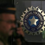 A policeman walks past a logo of the Board of Control for Cricket in India (BCCI) during a governing council meeting of the Indian Premier L A policeman walks past a logo of the Board of Control for Cricket in India (BCCI) during a governing council meeting of the Indian Premier L