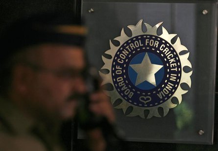 A policeman walks past a logo of the Board of Control for Cricket in India (BCCI) during a governing council meeting of the Indian Premier L A policeman walks past a logo of the Board of Control for Cricket in India (BCCI) during a governing council meeting of the Indian Premier L