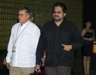 Colombia's Revolutionary Armed Forces of Colombia (FARC) lead negotiator Ivan Marquez (R) walks next to fellow negotiator Ricardo Tellez as Colombia's Revolutionary Armed Forces of Colombia (FARC) lead negotiator Ivan Marquez (R) walks next to fellow negotiator Ricardo Tellez as