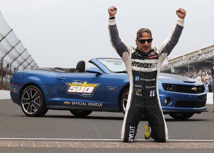 KV Racing Technology driver Tony Kanaan of Brazil kneels on the start/finish line after winning the 97th running of the Indianapolis 500 at KV Racing Technology driver Tony Kanaan of Brazil kneels on the start/finish line after winning the 97th running of the Indianapolis 500 at