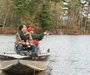 Governor Scott Walker admires that cast of one of his fishing buddies, 11-year-old  August Rassmussen.
