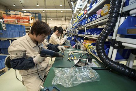 A worker assembles components at a workshop of Bernard Controls in Beijing April 25, 2013. REUTERS/Ed Jones/Pool A worker assembles components at a workshop of Bernard Controls in Beijing April 25, 2013. REUTERS/Ed Jones/Pool