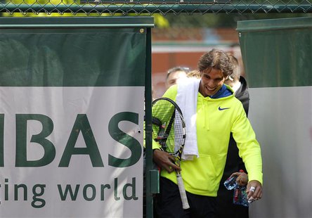 Rafael Nadal of Spain arrives for a training session at the French Open tennis tournament at the Roland Garros stadium in Paris May 25, 2013 Rafael Nadal of Spain arrives for a training session at the French Open tennis tournament at the Roland Garros stadium in Paris May 25, 2013