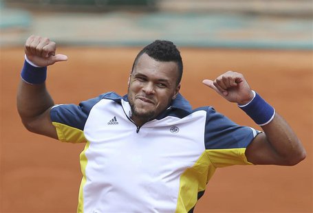 Jo-Wilfried Tsonga of France celebrates defeating Aljaz Bedene of Slovenia in their men's singles match during the French Open tennis tourna Jo-Wilfried Tsonga of France celebrates defeating Aljaz Bedene of Slovenia in their men's singles match during the French Open tennis tourna