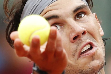 Rafael Nadal of Spain prepares to serve to Daniel Brands of Germany during their men's singles match at the French Open tennis tournament at Rafael Nadal of Spain prepares to serve to Daniel Brands of Germany during their men's singles match at the French Open tennis tournament at