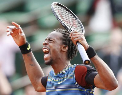 Gael Monfils of France reacts during his men's singles match against Tomas Berdych of Czech Republic at the French Open tennis tournament at Gael Monfils of France reacts during his men's singles match against Tomas Berdych of Czech Republic at the French Open tennis tournament at