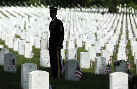 A member of the honor guard stands at attention as U.S. President Barack Obama arrives in his motorcade for Memorial Day observances at Arlington National Cemetery in Arlington, Virginia, May 27, 2013.
REUTERS/Jonathan Ernst
A member of the honor guard stands at attention as U.S. President Barack Obama arrives in his motorcade for Memorial Day observances at Arlington National Cemetery in Arlington, Virginia, May 27, 2013.
REUTERS/Jonathan Ernst