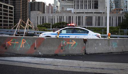 A police car stops at the entrance to the Brooklyn Bridge on Memorial Day in New York May 27, 2013.
REUTERS/Carlo Allegri
A police car stops at the entrance to the Brooklyn Bridge on Memorial Day in New York May 27, 2013.
REUTERS/Carlo Allegri