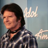 Singer John Fogerty poses in the backroom after performing at the 11th season finale of "American Idol" in Los Angeles, California, May 23, 