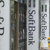 A clerk works in front of a SoftBank Corp branch in Tokyo May 29, 2013. REUTERS/Toru Hanai
