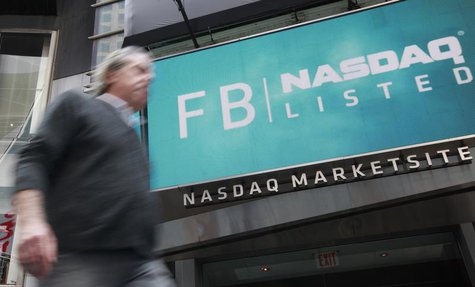 A man walks past a sign welcoming Facebook to the NASDAQ Marketsite in New York May 18, 2012. REUTERS/Brendan McDermid A man walks past a sign welcoming Facebook to the NASDAQ Marketsite in New York May 18, 2012. REUTERS/Brendan McDermid