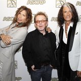 Steven Tyler (L) and Joe Perry (R) of the group Aerosmith pose with ASCAP president Paul Williams during a photo opportunity in Los Angeles 