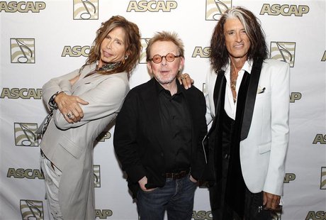 Steven Tyler (L) and Joe Perry (R) of the group Aerosmith pose with ASCAP president Paul Williams during a photo opportunity in Los Angeles Steven Tyler (L) and Joe Perry (R) of the group Aerosmith pose with ASCAP president Paul Williams during a photo opportunity in Los Angeles