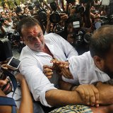 Bollywood actor Sanjay Dutt is escorted by his security staff as he arrives to surrender at a court in Mumbai May 16, 2013. REUTERS/Vivek Pr Bollywood actor Sanjay Dutt is escorted by his security staff as he arrives to surrender at a court in Mumbai May 16, 2013. REUTERS/Vivek Pr