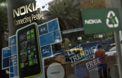 A man is reflected on the glass door of a Nokia showroom in New Delhi March 28, 2013. REUTERS/Mansi Thapliyal A man is reflected on the glass door of a Nokia showroom in New Delhi March 28, 2013. REUTERS/Mansi Thapliyal