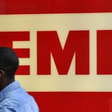 A man enters EMI offices in west London August 18, 2010. REUTERS/Toby Melville