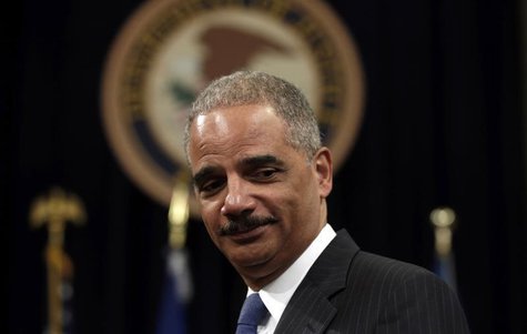 U.S. Attorney General Eric Holder looks on during a special naturalization ceremony at the Department of Justice in Washington May 28, 2013. U.S. Attorney General Eric Holder looks on during a special naturalization ceremony at the Department of Justice in Washington May 28, 2013.