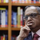N. R. Narayana Murthy, founder and chairman of Infosys, listens to a question during an interview with Reuters at the company's office in Ba