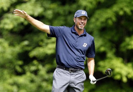 Matt Kuchar of the U.S. reacts to his second shot on the 15th hole during the third round of the Memorial Tournament at Muirfield Village Go Matt Kuchar of the U.S. reacts to his second shot on the 15th hole during the third round of the Memorial Tournament at Muirfield Village Go