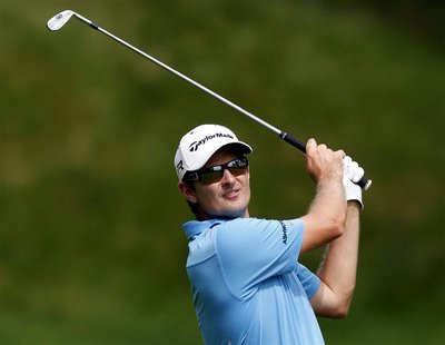 Justin Rose of England watches his second shot on the 15th hole during the third round of the Memorial Tournament at Muirfield Village Golf Justin Rose of England watches his second shot on the 15th hole during the third round of the Memorial Tournament at Muirfield Village Golf