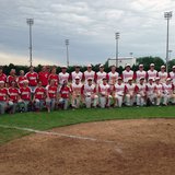 The Coldwater Cardinal softball and baseball teams pose at Pat Lowe Field with their MHSAA District Championship trophies on June 1, 2013.