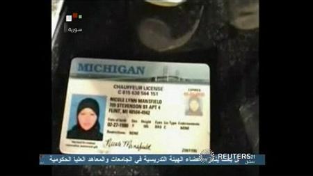 A still image taken from video broadcasted by Syrian TV on May 30, 2013, shows a Michigan driving license that Syrian TV say belongs to 33-year-old U.S. citizen Nicole Mansfield, it claims was killed in Syria while fighting with opposition forces against the government of Syrian President Bashar al-Assad in the country's civil war, her family said.
REUTERS/Syrian TV via Reuters TV A still image taken from video broadcasted by Syrian TV on May 30, 2013, shows a Michigan driving license that Syrian TV say belongs to 33-year-old U.S. citizen Nicole Mansfield, it claims was killed in Syria while fighting with opposition forces against the government of Syrian President Bashar al-Assad in the country's civil war, her family said.
REUTERS/Syrian TV via Reuters TV