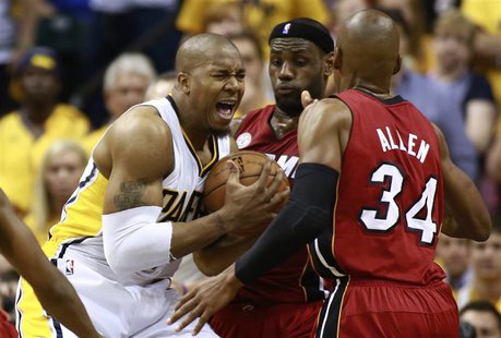 Indiana Pacers' David West (L) battles to the basket against Miami Heat's LeBron James (C) and Ray Allen in Game 6 of their NBA Eastern Conf Indiana Pacers' David West (L) battles to the basket against Miami Heat's LeBron James (C) and Ray Allen in Game 6 of their NBA Eastern Conf