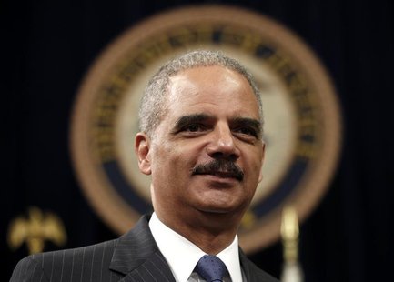 U.S. Attorney General Eric Holder looks on during a special naturalization ceremony at the Department of Justice in Washington May 28, 2013. U.S. Attorney General Eric Holder looks on during a special naturalization ceremony at the Department of Justice in Washington May 28, 2013.