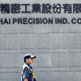 A security guard patrols at Hong Hai headquarters in Tucheng, Taipei county, June 8, 2010. REUTERS/Pichi Chuang