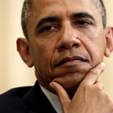 U.S. President Barack Obama listens during a meeting with NATO Secretary General Anders Fogh Rasmussen in the Oval Office of the White House
