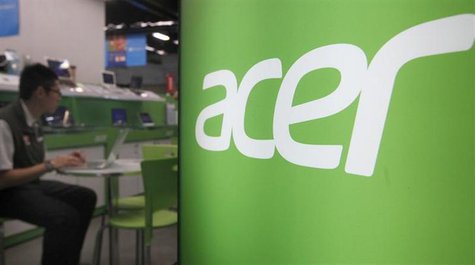 A shop attendant sits in an Acer booth in a computer mall in Taipei March 19, 2013. REUTERS/Pichi Chuang A shop attendant sits in an Acer booth in a computer mall in Taipei March 19, 2013. REUTERS/Pichi Chuang