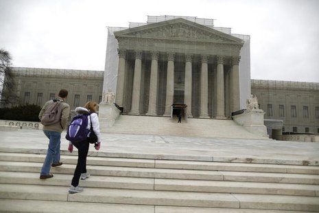 Tourists walk in front of the Supreme Court building in Washington, March 24, 2013. REUTERS/Jonathan Ernst Tourists walk in front of the Supreme Court building in Washington, March 24, 2013. REUTERS/Jonathan Ernst