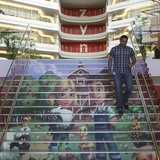 Player avatars from Zynga's FarmVille 2 are seen on a stairway at the entrance to Zynga headquarters in San Francisco, California April 23, 