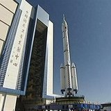 China's new manned Shenzhou-10 spacecraft and its carrier Long March 2-F rocket are seen as they are transferred to their launching site at 