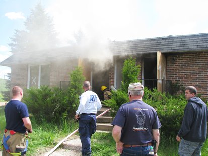 Wausau fire crews move in to extinguish a training fire in a blighted apartment building, June 3 2013 Wausau fire crews move in to extinguish a training fire in a blighted apartment building, June 3 2013
