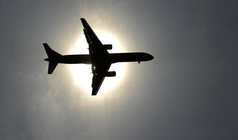 A plane approaching Leeds Bradford airport passes in front of the sun during the second test cricket match between England and New Zealand a A plane approaching Leeds Bradford airport passes in front of the sun during the second test cricket match between England and New Zealand a