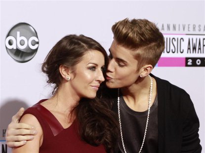 Pop star Justin Bieber (R) arrives with his mother Pattie Mallette at the 40th American Music Awards in Los Angeles, California November 18, Pop star Justin Bieber (R) arrives with his mother Pattie Mallette at the 40th American Music Awards in Los Angeles, California November 18,