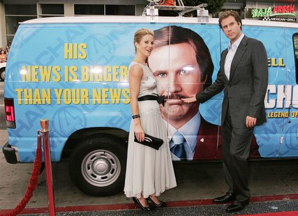 Actor Will Ferrell and actress Christina Applegate pose next to a "news van" which they arrived in for the premiere of their new comedy film Actor Will Ferrell and actress Christina Applegate pose next to a "news van" which they arrived in for the premiere of their new comedy film