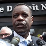 Detroit's emergency financial manager Kevyn Orr talks to members of the media outside the Detroit Newspapers building about the report he de