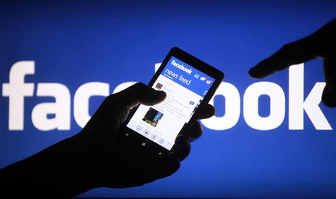 A smartphone user shows the Facebook application on his phone in the central Bosnian town of Zenica, in this photo illustration taken May 2, A smartphone user shows the Facebook application on his phone in the central Bosnian town of Zenica, in this photo illustration taken May 2,