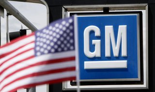The U.S. flag flies at the Burt GM auto dealer in Denver June 1, 2009. REUTERS/Rick Wilking The U.S. flag flies at the Burt GM auto dealer in Denver June 1, 2009. REUTERS/Rick Wilking