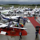 Visitors walk past aircrafts in the static display area during the Annual European Business Aviation Convention & Exhibition (EBACE) at Coin Visitors walk past aircrafts in the static display area during the Annual European Business Aviation Convention & Exhibition (EBACE) at Coin