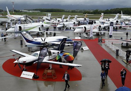 Visitors walk past aircrafts in the static display area during the Annual European Business Aviation Convention & Exhibition (EBACE) at Coin Visitors walk past aircrafts in the static display area during the Annual European Business Aviation Convention & Exhibition (EBACE) at Coin