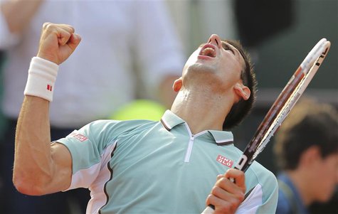 Novak Djokovic of Serbia celebrates defeating Tommy Haas of Germany in their men's singles quarter-final match during the French Open tennis Novak Djokovic of Serbia celebrates defeating Tommy Haas of Germany in their men's singles quarter-final match during the French Open tennis
